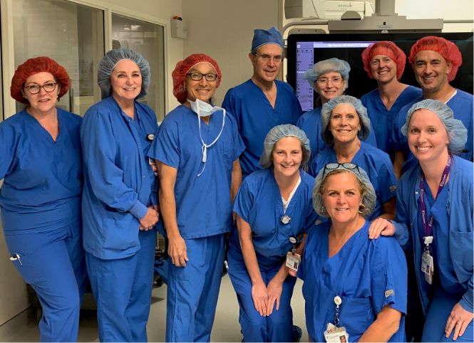 A group of Christ Hospital nurses smiling together with text that reads &ldquo;6,500+ team members&rdquo;